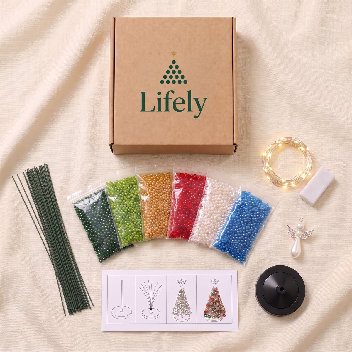 Beaded tree kit contents: sorted beads, wires, lights, angel topper, base and guide