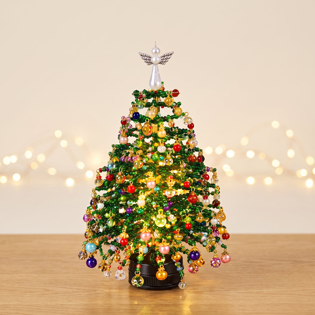 Lifely beaded Christmas tree glowing with warm lights